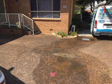 water leak under driveway